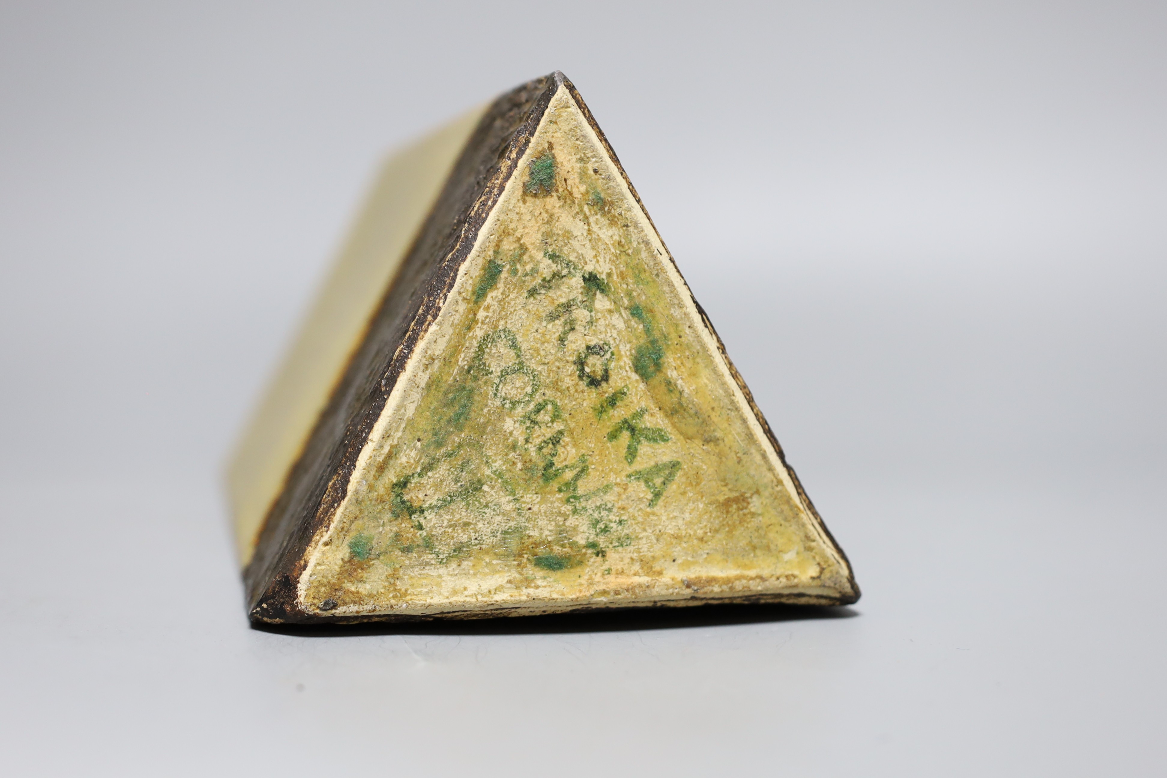 A glazed pottery triangular vase, inscribed Troika England 33cms high